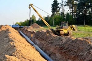 Lawn excavation (with visible pipes)