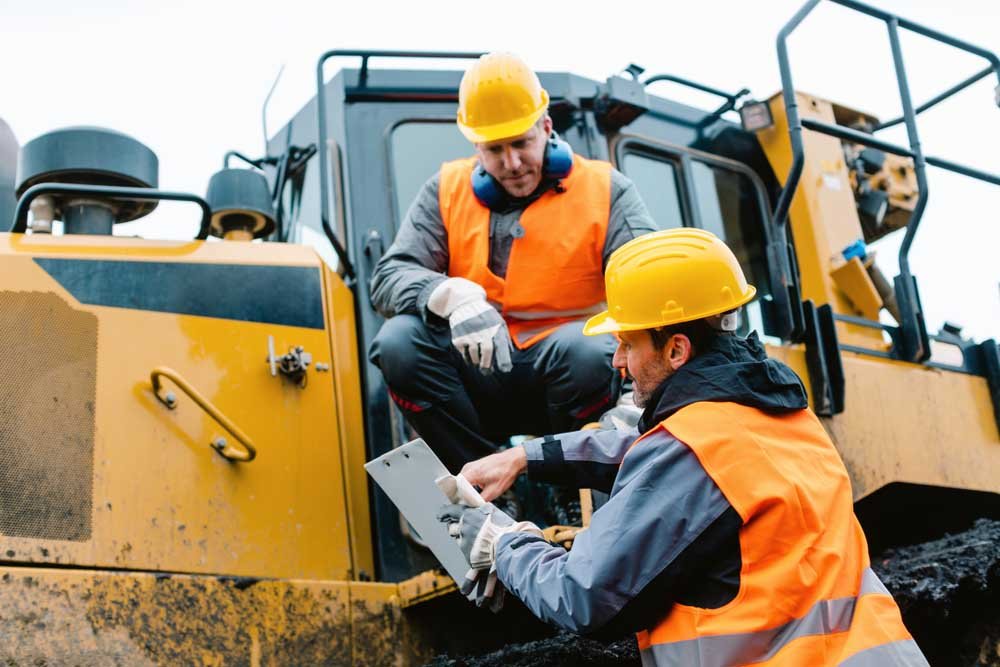 Worker sitting on heavy excavation machinery Sioux City, IA Worker sitting on heavy excavation machinery Sioux City, IA